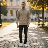 WILDVINE Clothing Co. man wearing a sandstorm beige merino wool quarter zip jumper with tonal eagle logo in a park.
