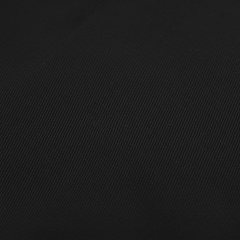 Close-up of black nylon fabric texture from a WILDVINE Clothing Co. hooded jacket