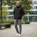 WILDVINE Clothing Co. model wearing a black Lyle & Scott nylon zip-through hooded jacket with grey trousers.