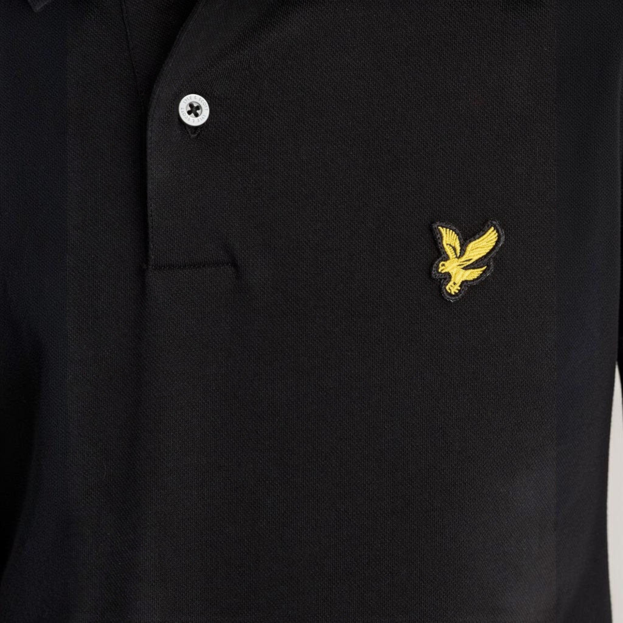 WILDVINE Clothing Co. Lyle & Scott jet black polo shirt featuring a yellow eagle logo embroidery and button placket.