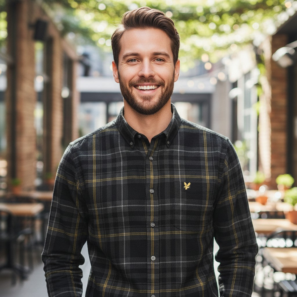 WILDVINE Clothing Co. man wearing a jet black Lyle & Scott fine tartan corduroy shirt with a button-down collar.