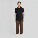 WILDVINE Clothing Co. Lyle & Scott jet black tipped track polo shirt with yellow eagle logo worn by a male model