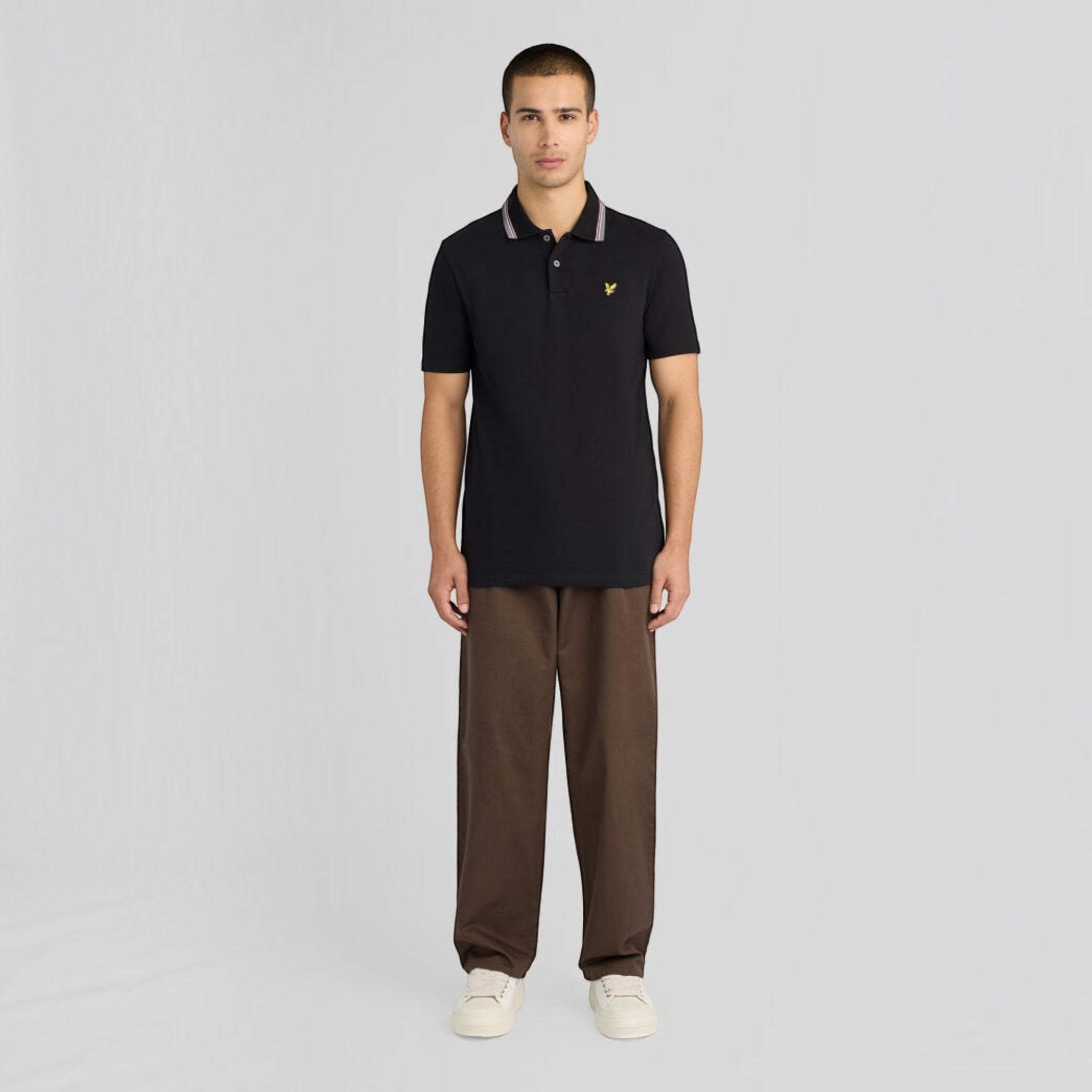 WILDVINE Clothing Co. Lyle & Scott jet black tipped track polo shirt with yellow eagle logo worn by a male model