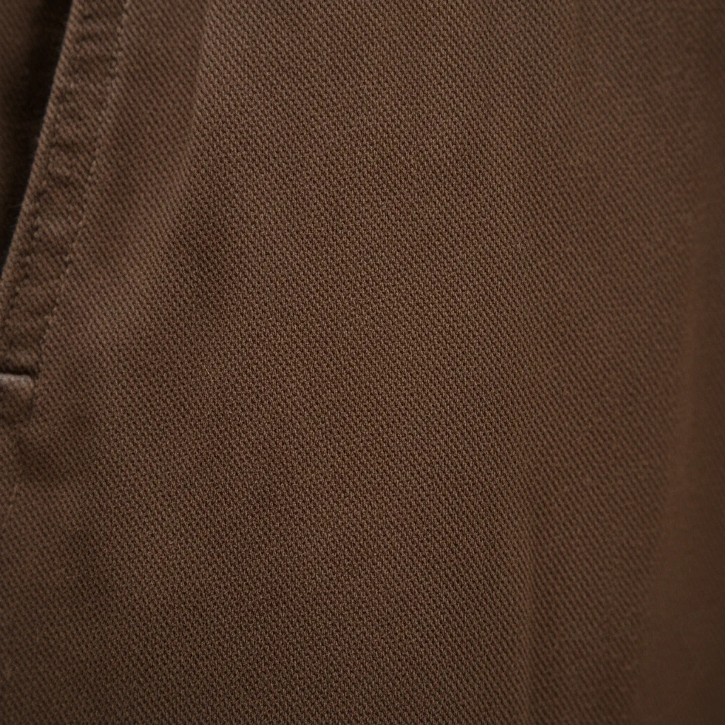 Close-up of brown fine texture fabric from WILDVINE Clothing Co. MEYER Chicago luxury chinos.