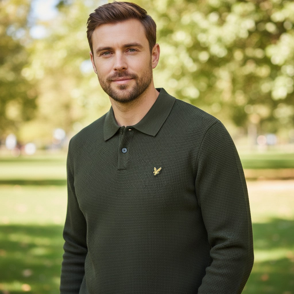 WILDVINE Clothing Co. man wearing a dark green waffle knit polo shirt with a classic collar and gold logo embroidery.