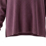 WILDVINE Clothing Co. mulberry V-neck knit sweater featuring a stepped hem with side slits and ribbed detailing.