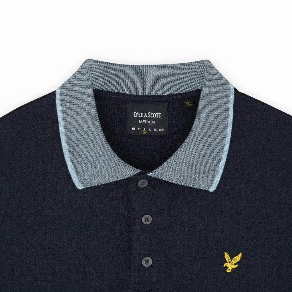 WILDVINE Clothing Co. Lyle & Scott dark navy polo shirt with a light blue birdseye knit collar and yellow eagle logo.