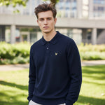 WILDVINE Clothing Co. man wearing a dark navy Lyle & Scott long-sleeve waffle knit polo shirt with a gold logo