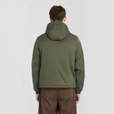 Back view of a man wearing a WILDVINE Clothing Co. olive green padded hooded zip-through jacket with elastic cuffs.