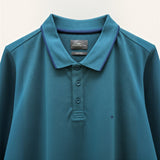 WILDVINE Clothing Co. teal Fynch-Hatton polo shirt in premium 2-ply pique cotton with a contrasting navy collar trim.