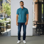 WILDVINE Clothing Co. teal 2-ply pique cotton polo shirt worn by a man with dark jeans and white sneakers
