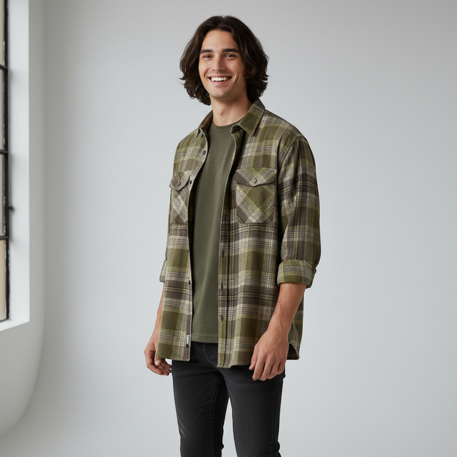 WILDVINE Clothing Co. Wrangler men's pesto green plaid western shirt worn over a t-shirt by a smiling man
